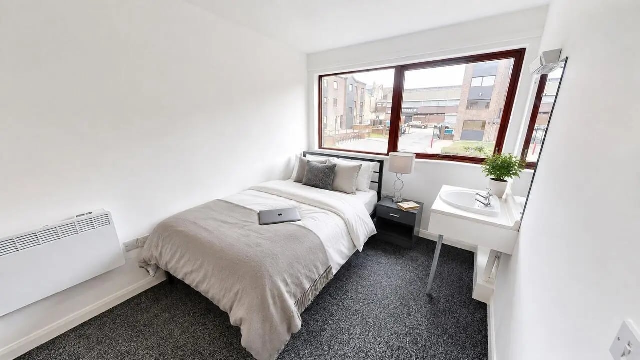 Bed sink nightstand heating and laptop bedroom at Clanny House in Sunderland Student Accommodation
