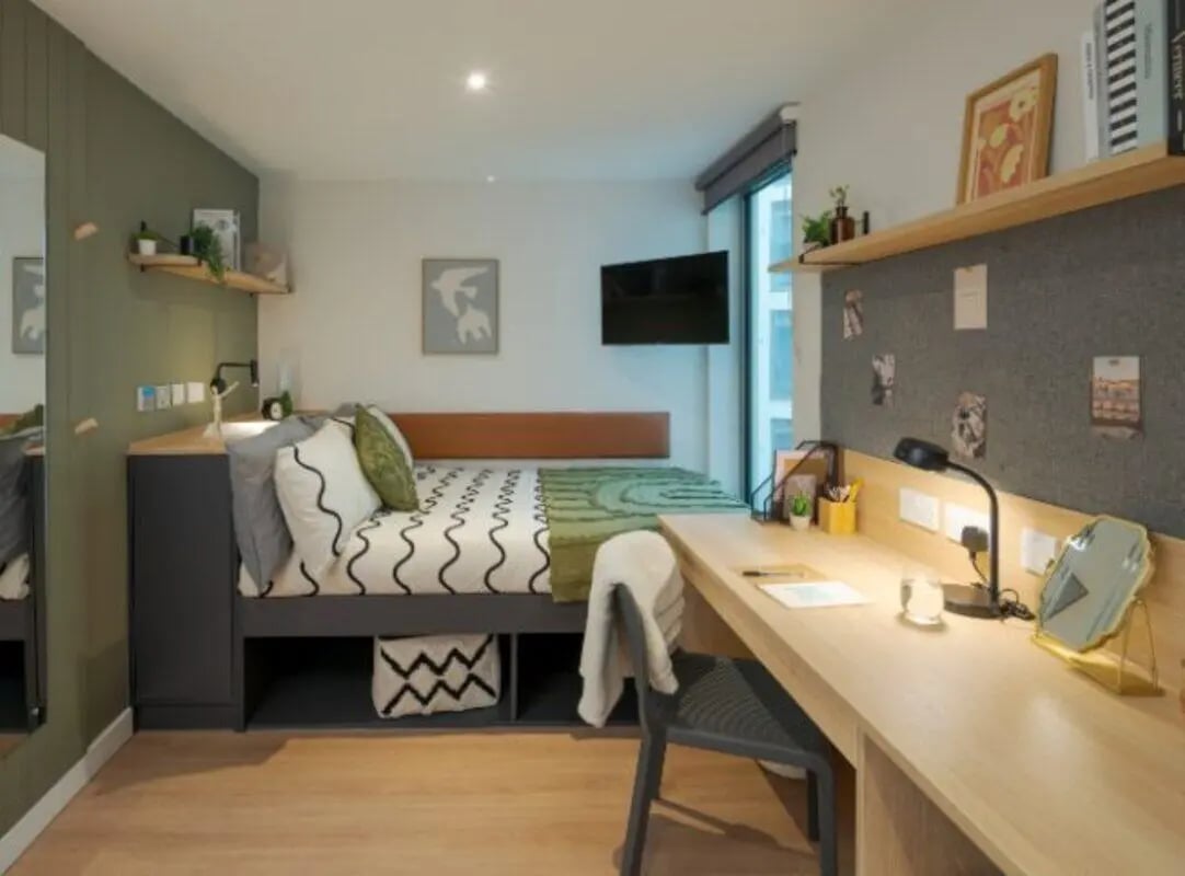 Bed desk lamp chair and bed with pillows bedroom at Fusion Students Liverpool in Liverpool Student Accommodation