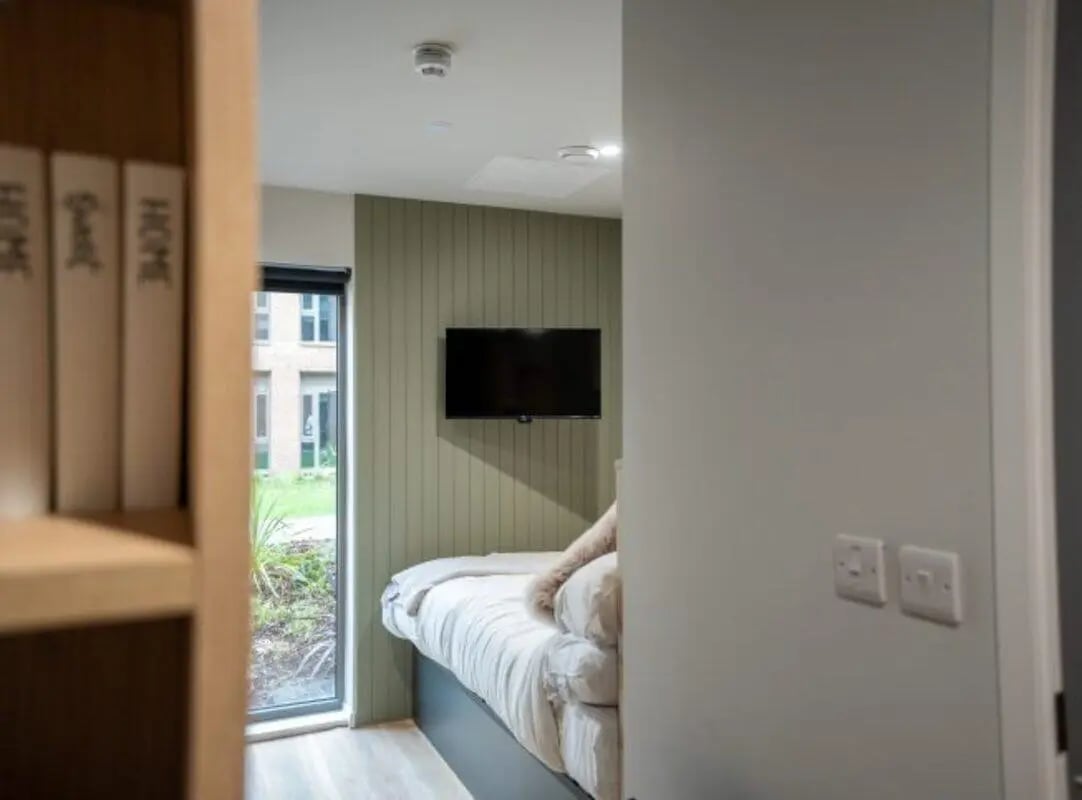 Bed with TV and window bedroom at Fusion Students York in York Student Accommodation