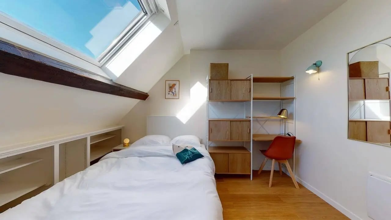 Bed with desk and shelves bedroom at Lucette - Private Room (10) in Pantin Student Accommodation