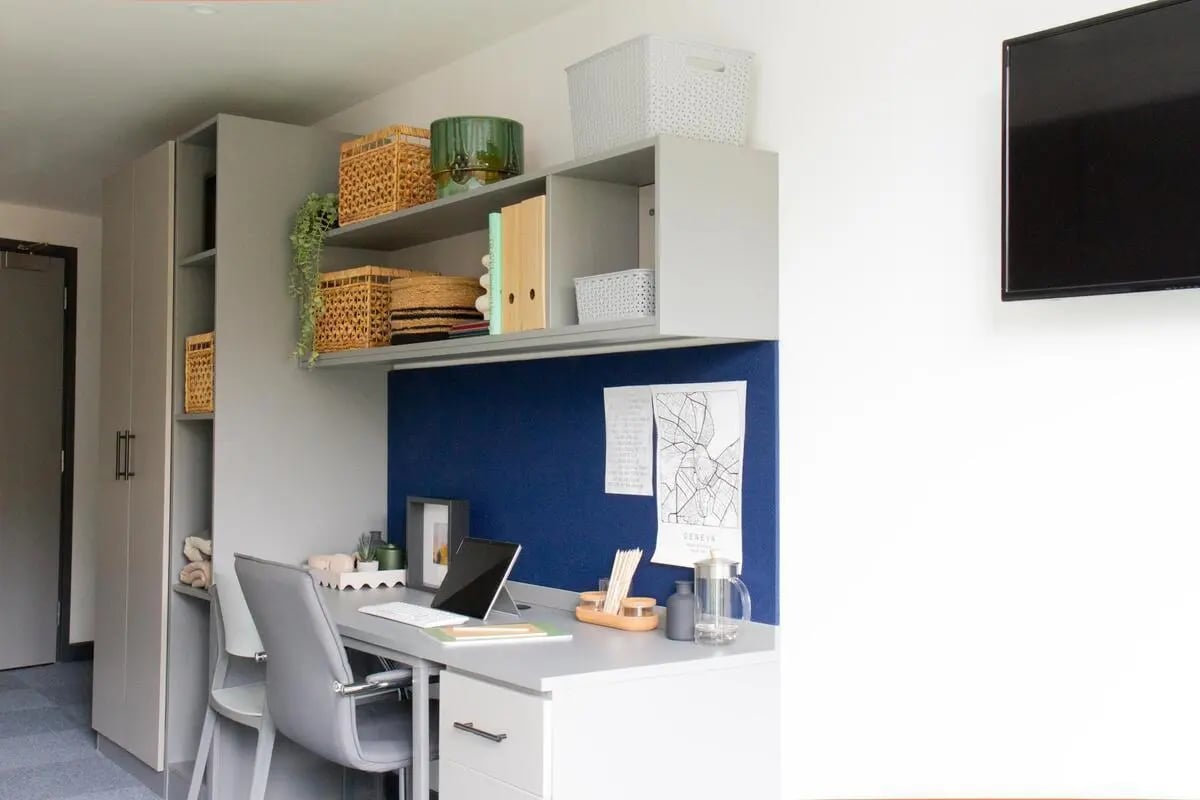 Desk chair laptop whiteboard baskets storage study area at Trapezium in Leeds Student Accommodation
