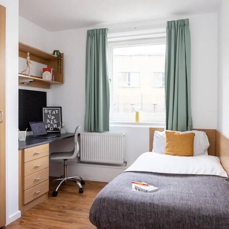 Desk bed radiator and shelf bedroom at Cranborne House in Bournemouth Student Accommodation