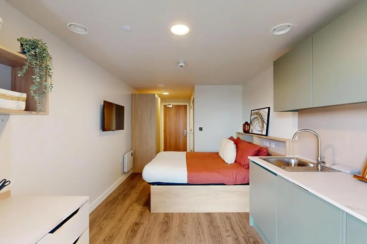 Bed sink cabinets and TV studio apartment at Burnsall House in Coventry Student Accommodation