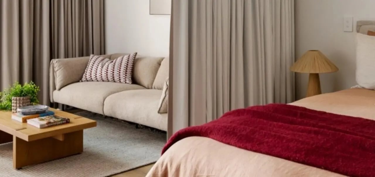 Sofa coffee table bedside lamp bedroom living room at Assemble Swiftwalk in Melbourne Student Accommodation