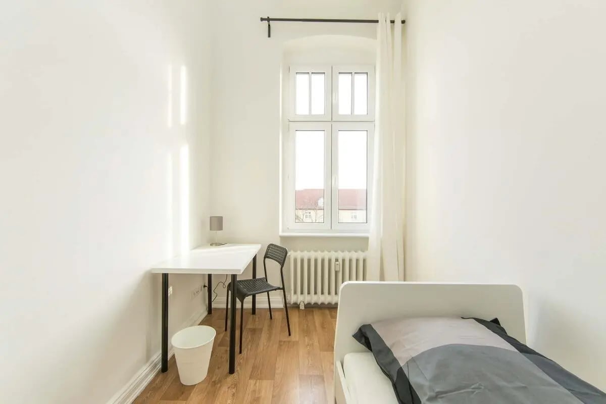 Desk chair lamp trash bin bed bedroom at Hohenzollerndamm 53.6 in Berlin Student Accommodation