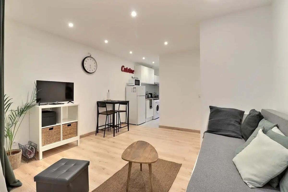 Living room with TV couch table and kitchen living room at Studio in Av. Félix Faure, 75015 Paris, France in Paris Student Accommodation