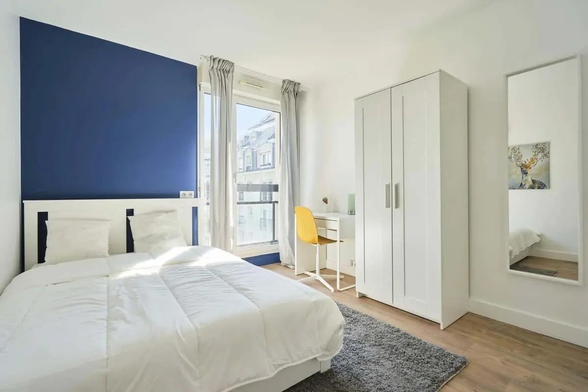 Bed wardrobe desk and mirror bedroom at Room in 121 Rue Haxo, 75019 Paris, France in Paris Student Accommodation