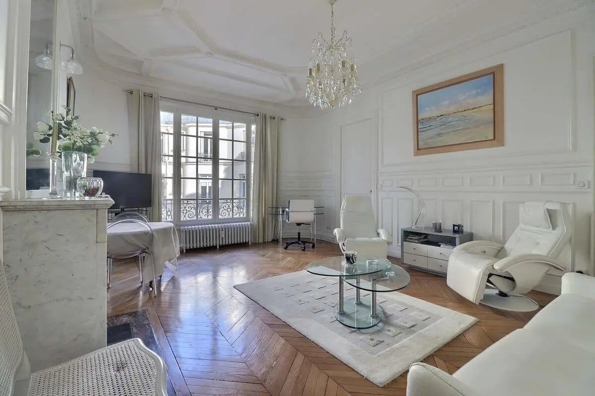 White recliners, glass table, study area, living room at Apartment in Rue Villaret de Joyeuse, 75017 Paris, France in Paris Student Accommodation