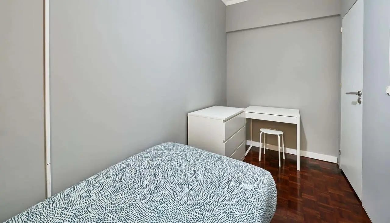 Bed chest of drawers desk stool bedroom at Casa Abel II – Room 5 in Lisbon Student Accommodation