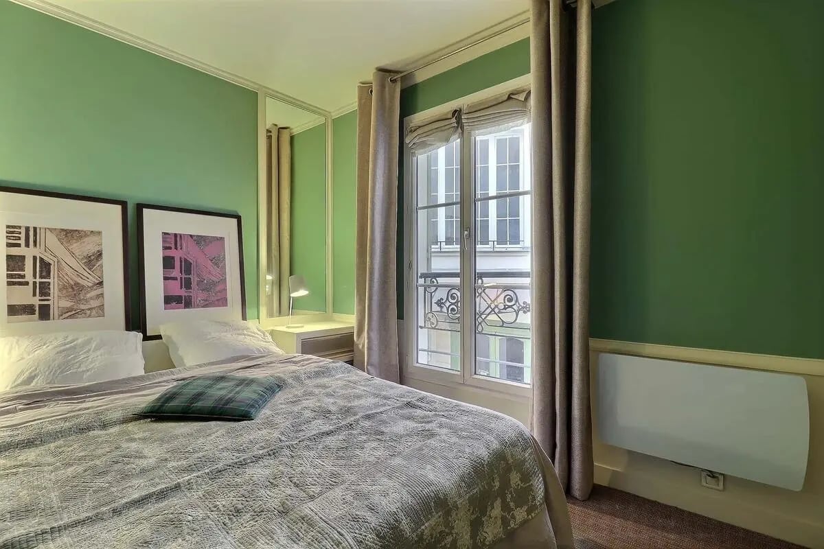 Bed with art and desk bedroom at Apartment in Rue Saint-Honoré, 75001 Paris, France in Paris Student Accommodation