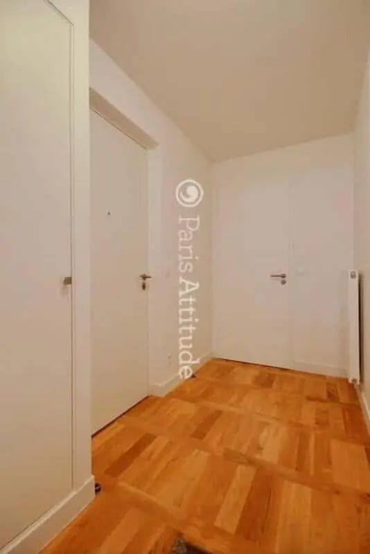 Hallway with wood floor and two doors hallway at Apartment in Rue de Clichy, 75009 Paris, France in Paris Student Accommodation