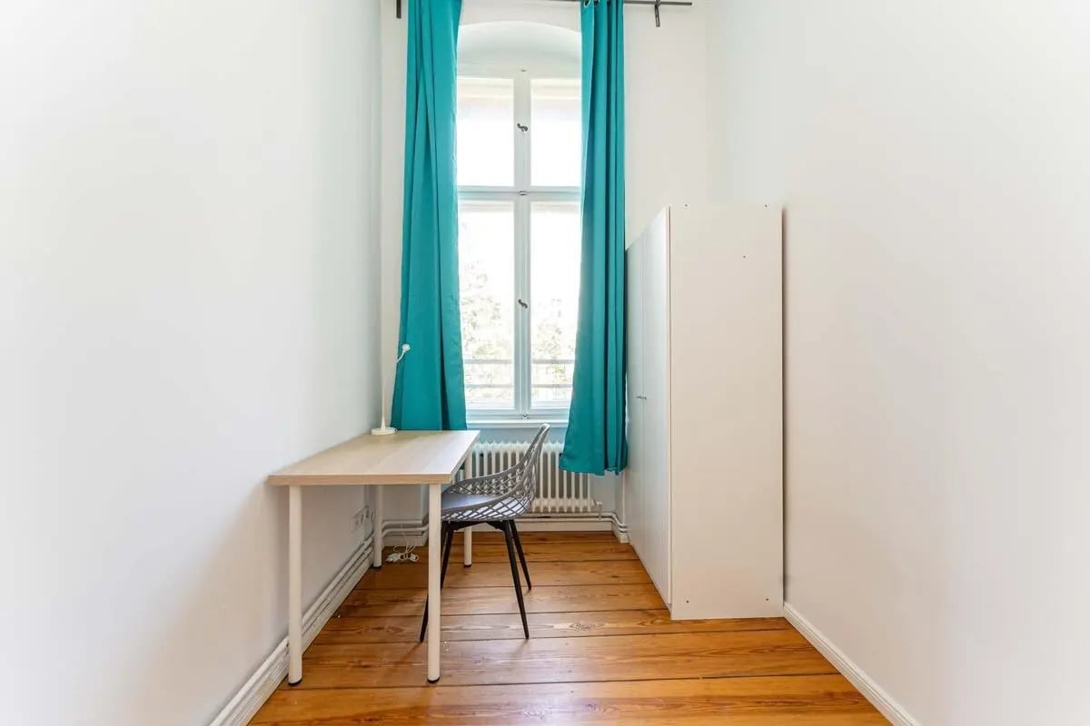Desk chair wardrobe and window study area at Kaiser-Friedrich-Straße - Room 4 in Berlin Student Accommodation