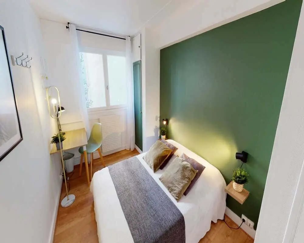 Bed desk lamp chair bed bedroom at Chambre dans le rue des morillons in Paris Student Accommodation