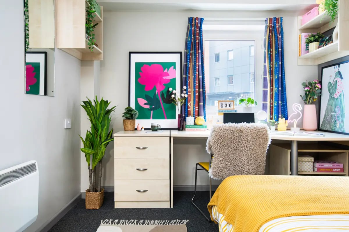 Desk dresser plants artwork and bed bedroom at Newarke Point in Leicester Student Accommodation