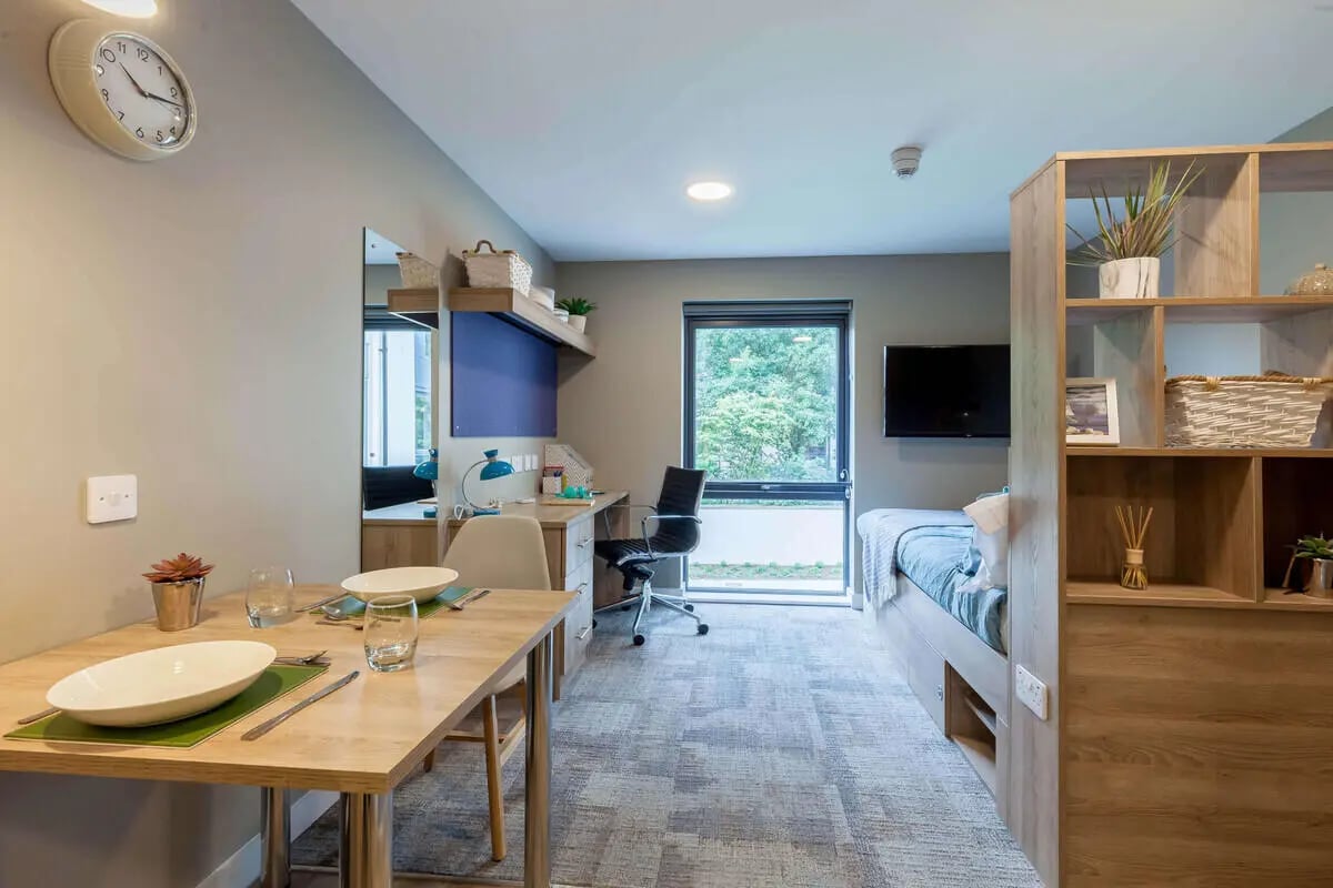 Dining table desk bed shelving unit bedroom at The Combworks in Aberdeen Student Accommodation