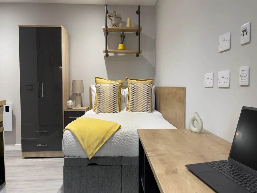 Wardrobe bed desk and shelving bedroom at The Coal Yard in York Student Accommodation