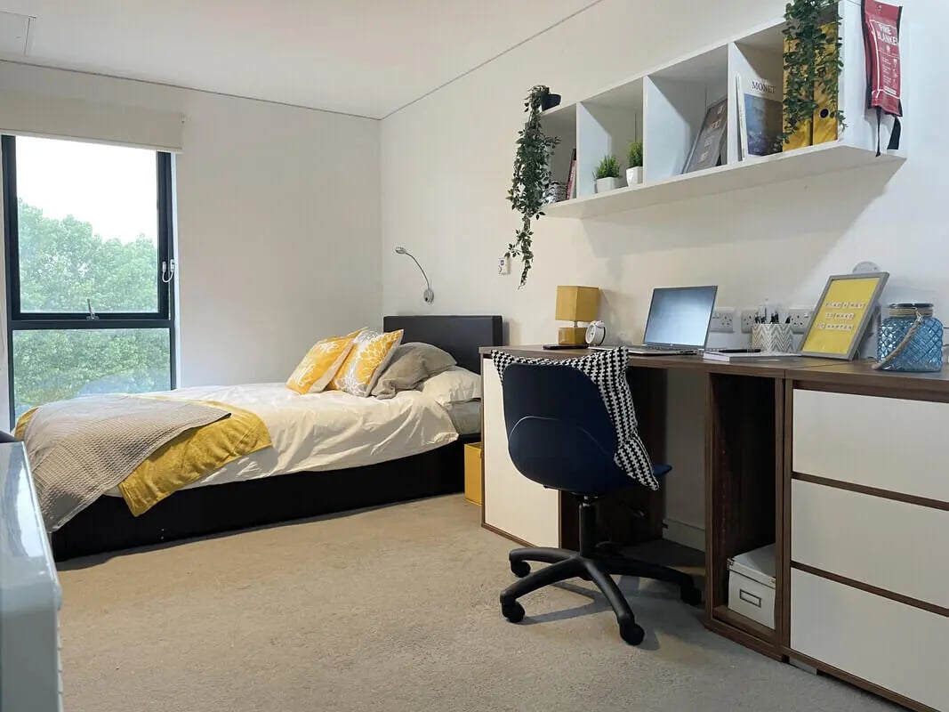 Bed desk shelf and chair student bedroom at Asquith House in Leeds Student Accommodation
