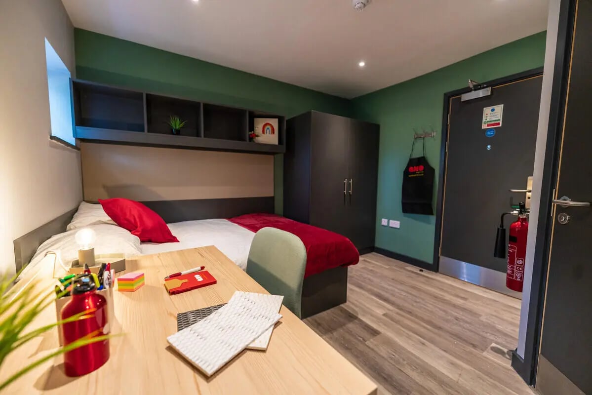 Bed desk wardrobe fire extinguisher bedroom at AXO Sherbourne Student Village in Coventry Student Accommodation