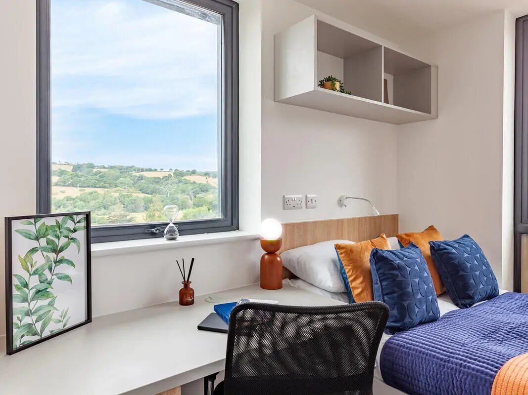 Desk with plants and hourglass student bedroom at Hill View Place in Exeter Student Accommodation
