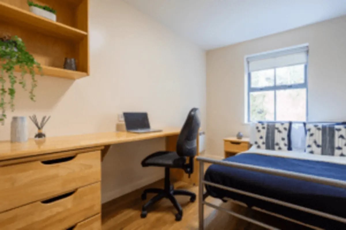 Desk laptop chair bed with blue bedding bedroom at dwell Hotwells House in Bristol Student Accommodation