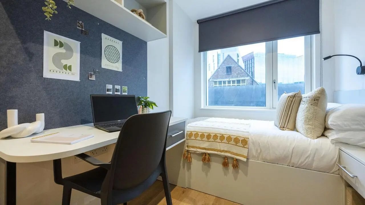 Desk with laptop bed and window bedroom at Sheares Hall in Newcastle Upon Tyne Student Accommodation