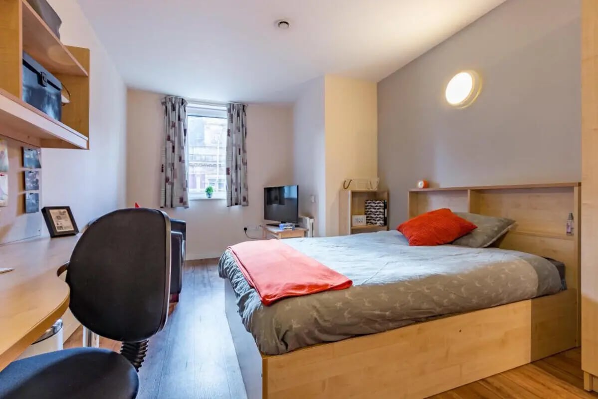 Bed desk chair and TV bedroom at Chambers 51 in Wolverhampton Student Accommodation