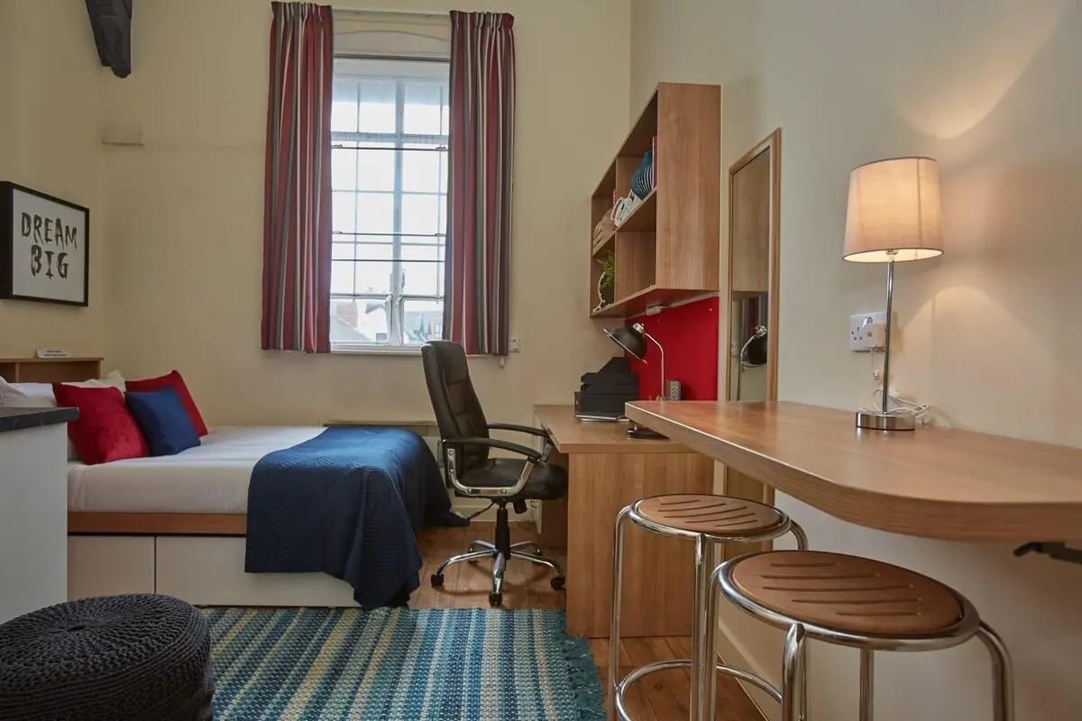 Bed desk chair and stools student room at Abbeygate in Chester Student Accommodation