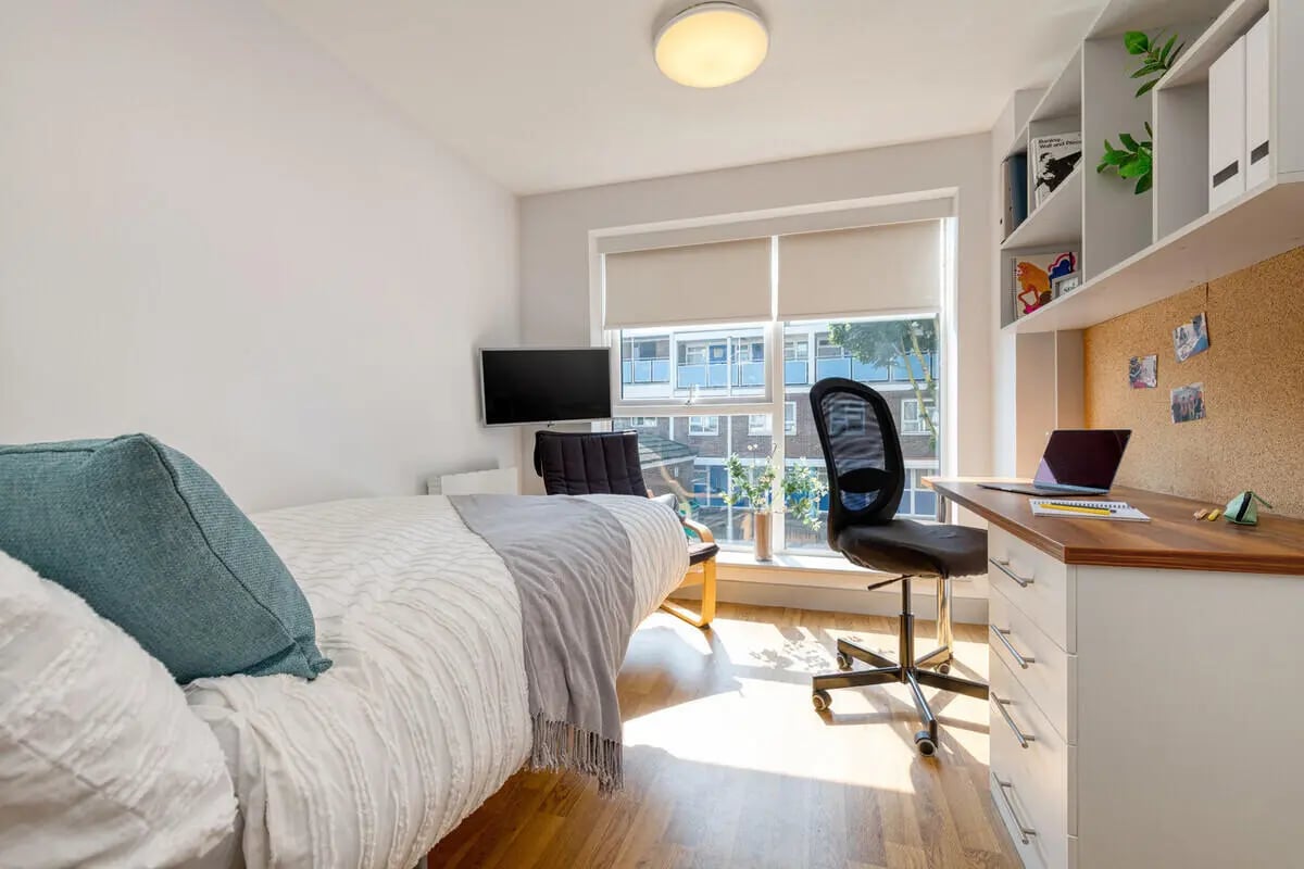 Bed desk chair shelves laptop television study area at Collegiate Earlsdon Street in Portsmouth Student Accommodation