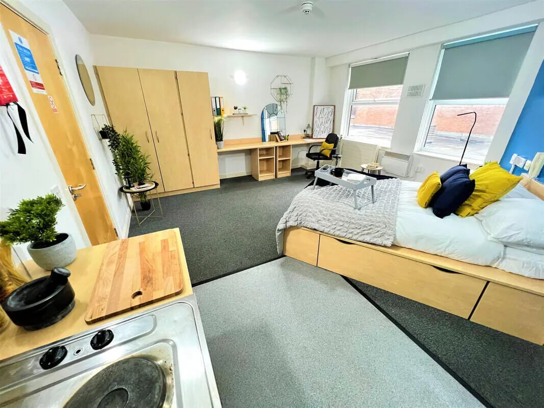 Bed desk wardrobe and kitchen area studio at Dunn House in Sunderland Student Accommodation