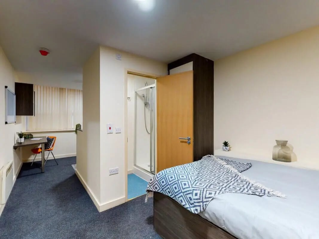 Bed study area shower bedroom at The Cube in Bolton Student Accommodation