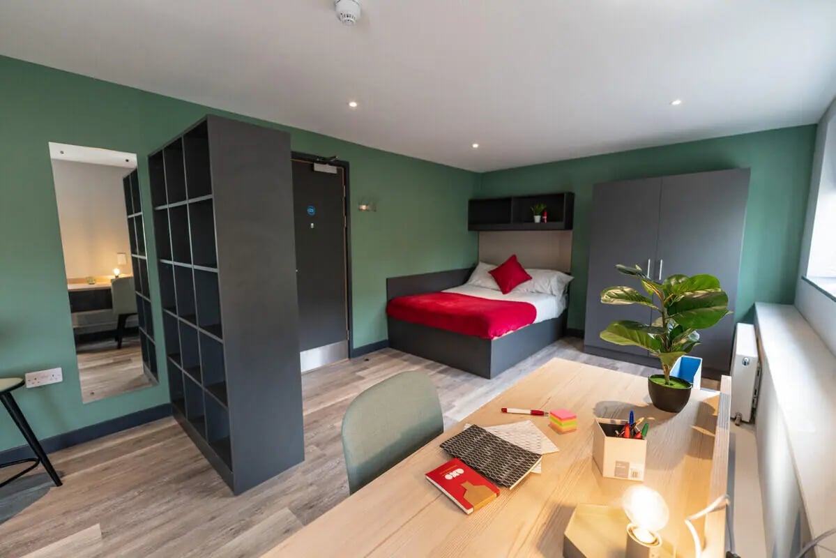 Bed study desk mirror shelving unit bedroom at AXO Sherbourne Student Village in Coventry Student Accommodation