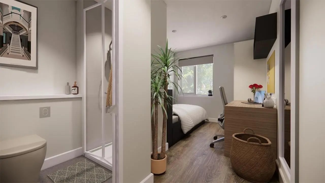 Toilet shower bed desk plants living room at Moss Court in Manchester Student Accommodation