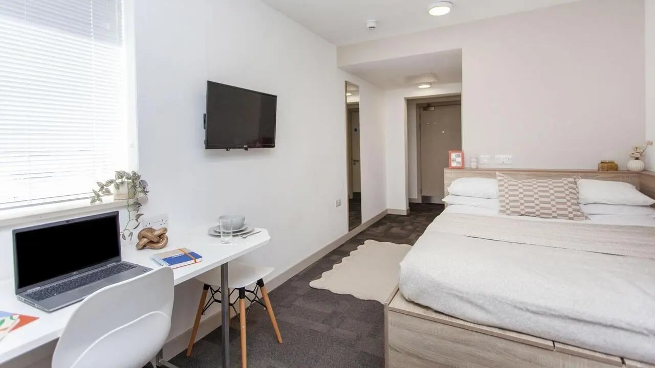 Bed laptop desk and television bedroom at Berkshire House Reading in Reading Student Accommodation