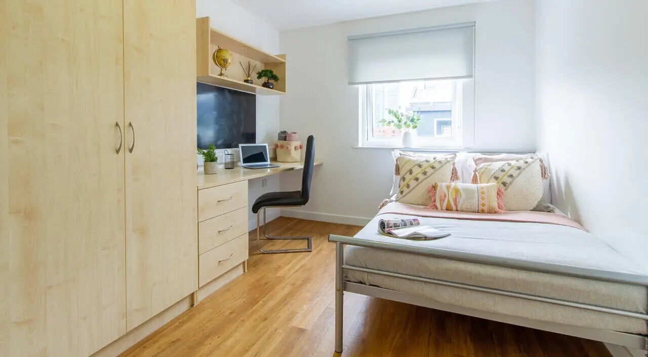 Bed desk wardrobe with laptop and television bedroom at Canalside in Birmingham Student Accommodation