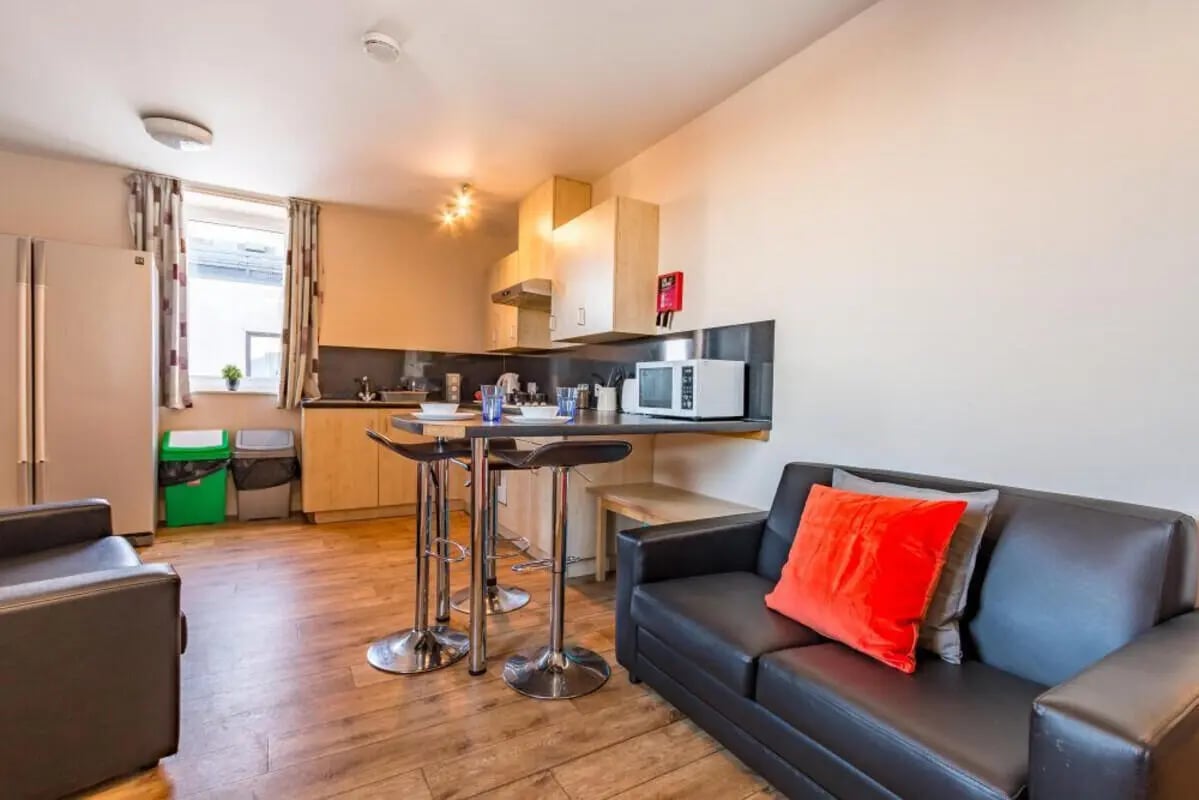 Sofa kitchen island with stools living room at Chambers 51 in Wolverhampton Student Accommodation