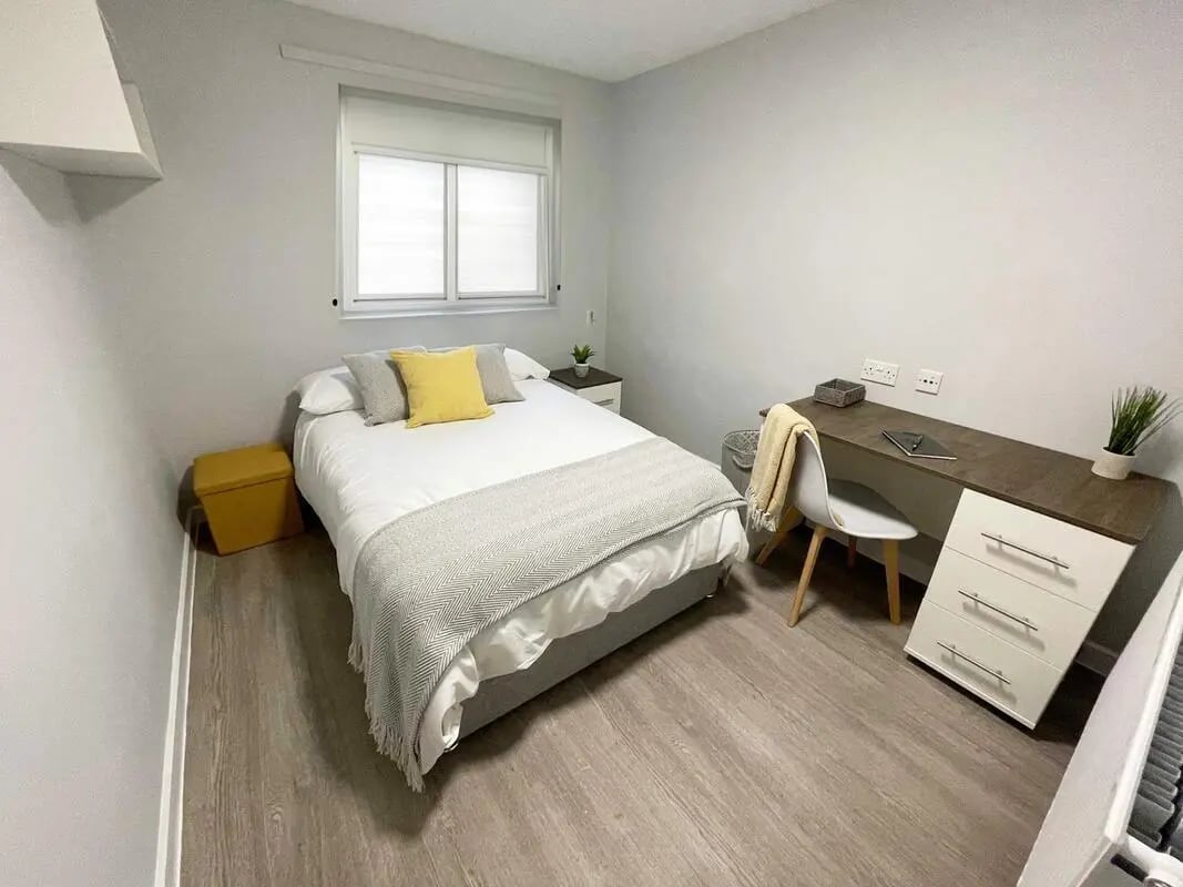 Bed desk chair and storage unit bedroom at Singer Hall in Coventry Student Accommodation