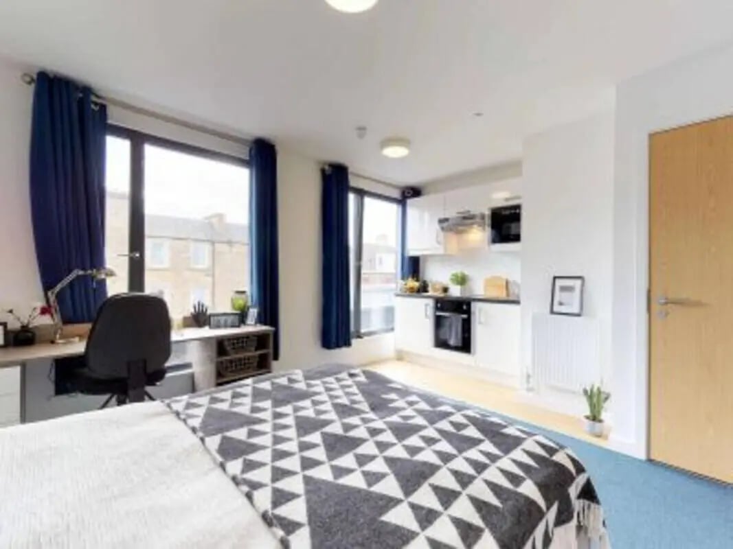 Bed desk kitchen and door studio apartment at Haymarket Edinburgh in Edinburgh Student Accommodation