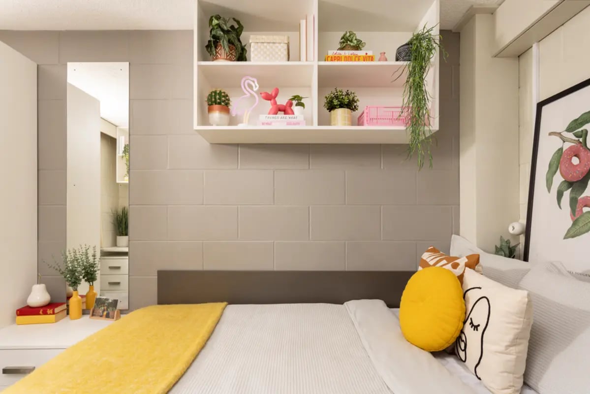 Bed with yellow throw and decor Bedroom at Spring Gardens in Aberdeen Student Accommodation