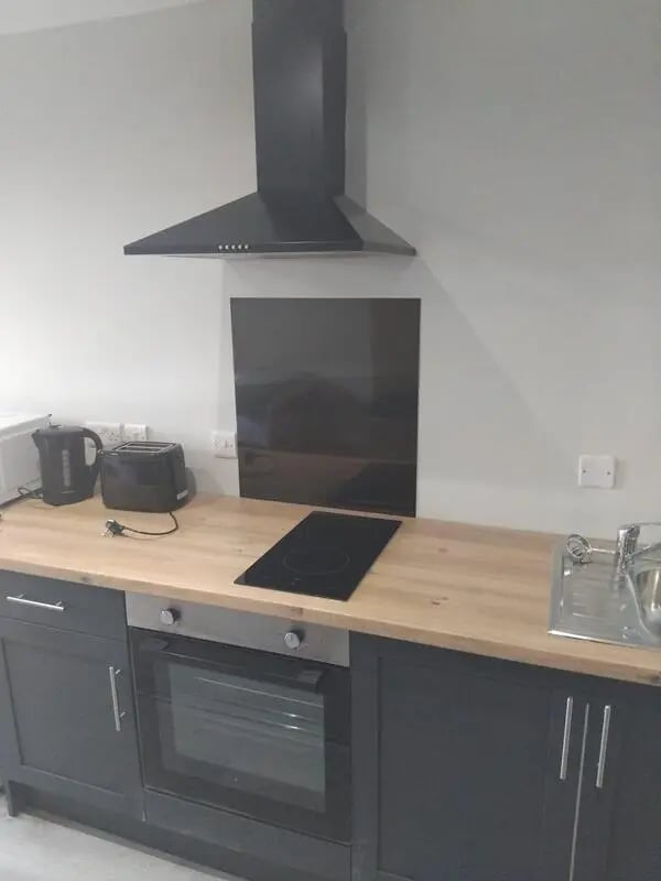 Kettle toaster oven hob sink kitchen at Longside House Bradford in Bradford Student Accommodation