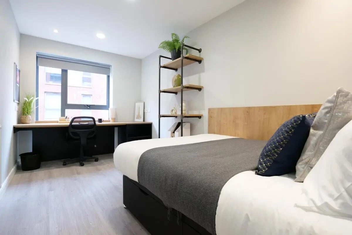 Bed desk shelves and plants bedroom at Electric Press in Sheffield Student Accommodation