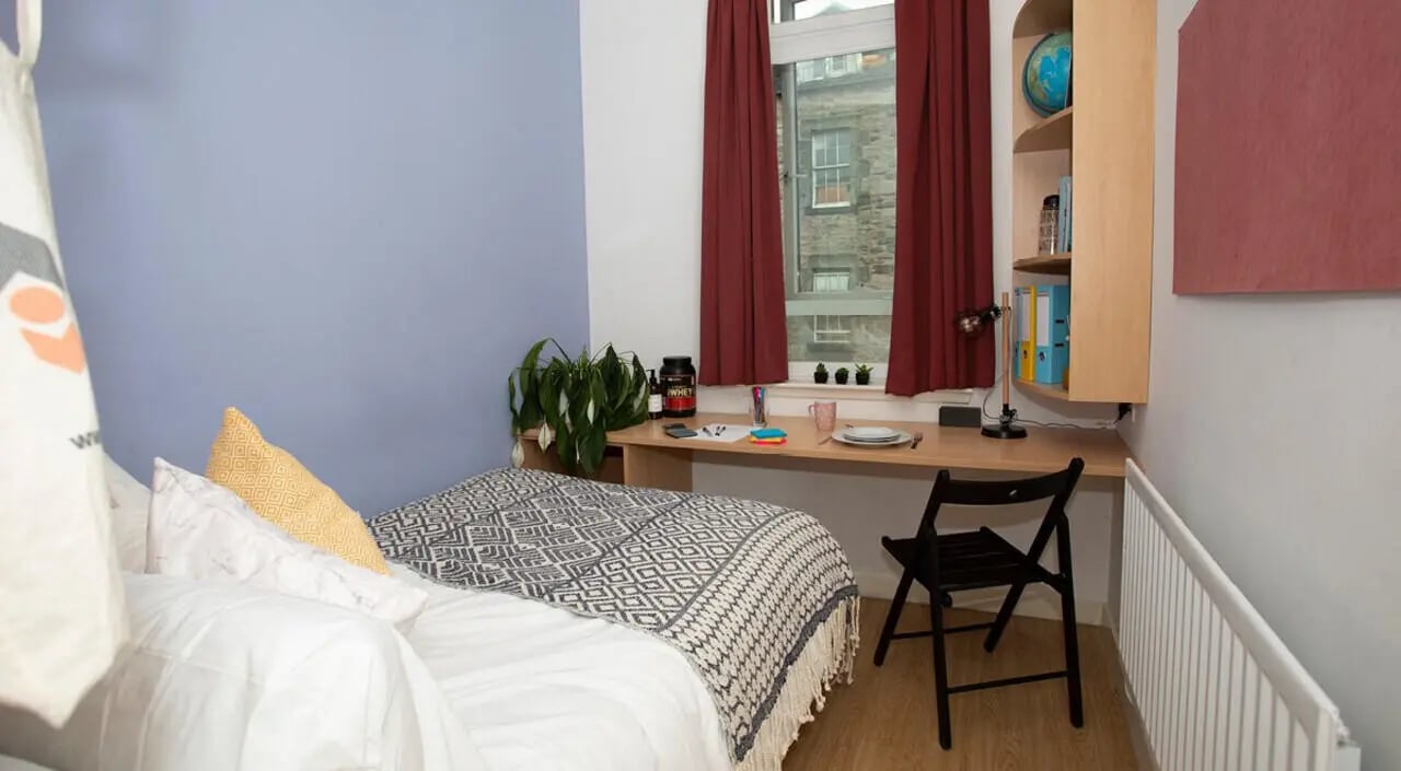 Bed desk chair and shelf bedroom at 200 Cowgate in Edinburgh Student Accommodation