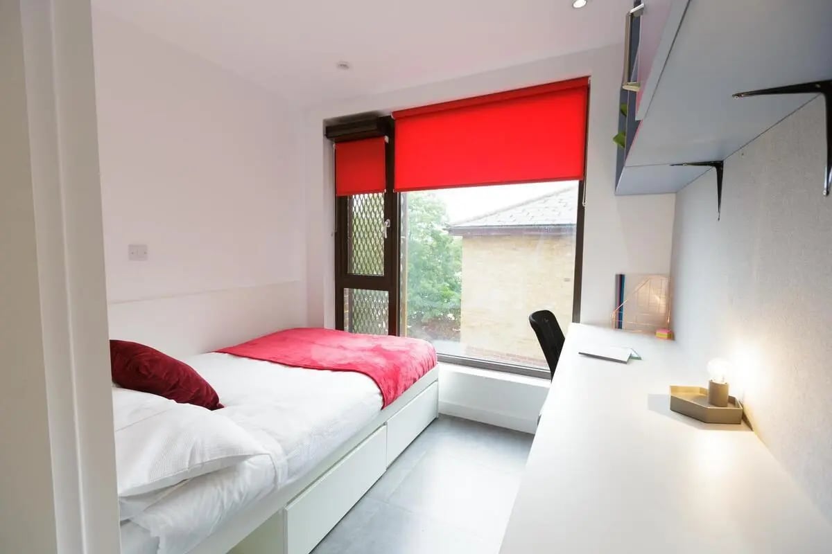 Bed desk chair and window Bedroom at AXO New Cross in London Student Accommodation