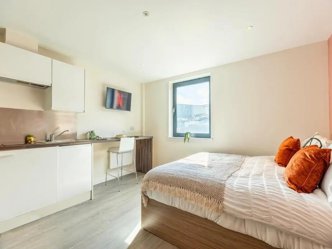 Bed kitchen and desk area studio apartment at Gallery Apartments in Glasgow Student Accommodation