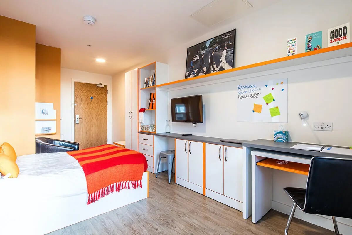 Bed desk storage shelf TV and whiteboard bedroom at Hannah Court in Sheffield Student Accommodation