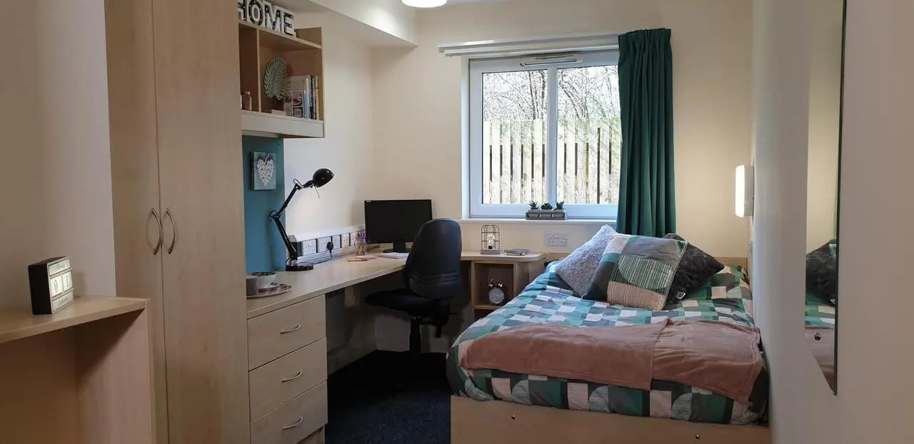 Bed desk wardrobe with shelves study area bedroom at The Cube - Loughborough in Loughborough Student Accommodation