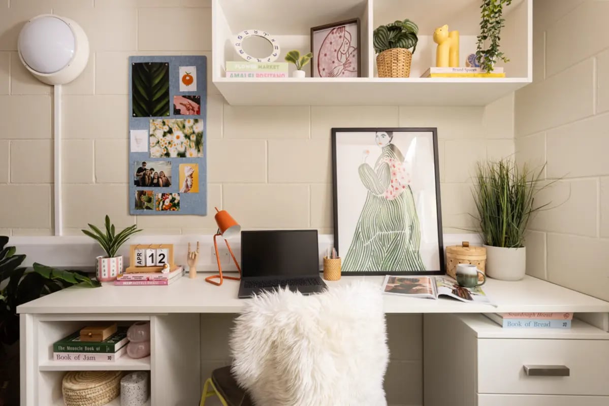 Desk with laptop photos and decor study area at Spring Gardens in Aberdeen Student Accommodation