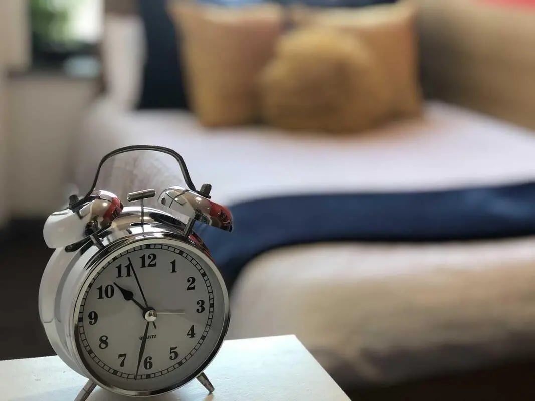 Alarm clock on table next to bed bedroom at Norflok Street in Sunderland Student Accommodation