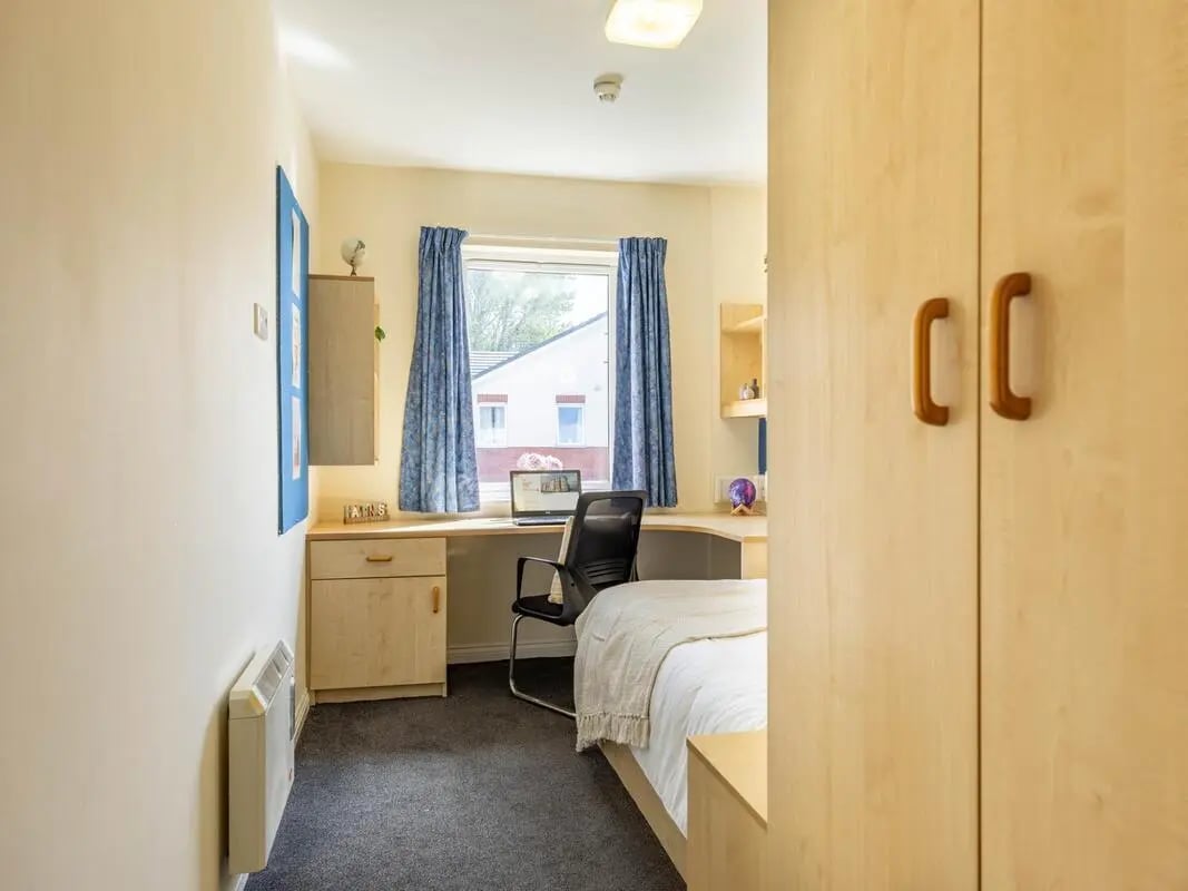 Wardrobe desk bed and chair bedroom at Foundry Court in Preston Student Accommodation