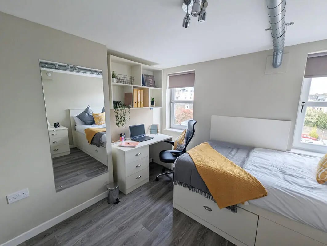 Desk bed mirror and shelves bedroom at Peterson Hall in Dundee Student Accommodation