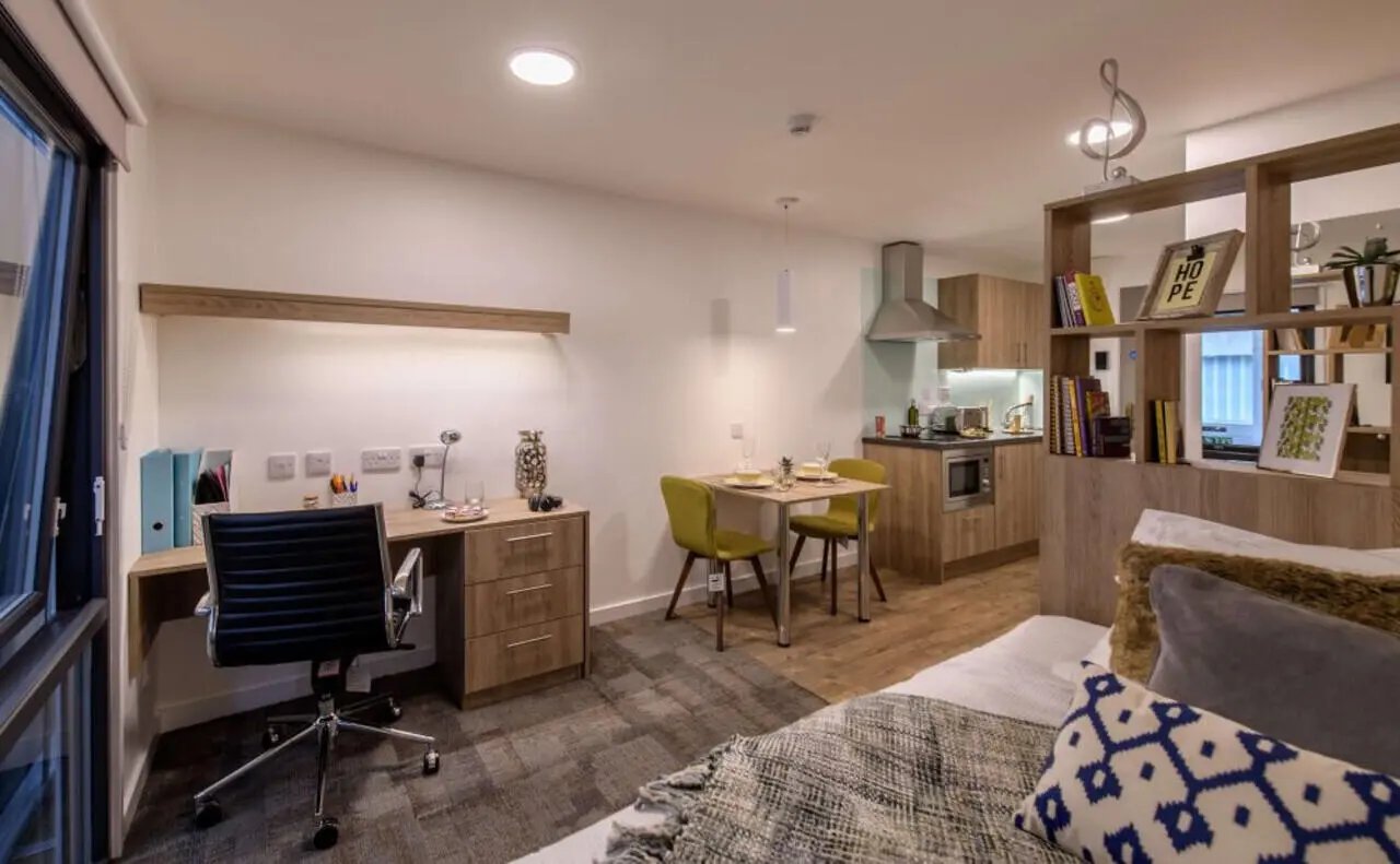 Desk chair table kitchen and bed studio apartment at The Combworks in Aberdeen Student Accommodation